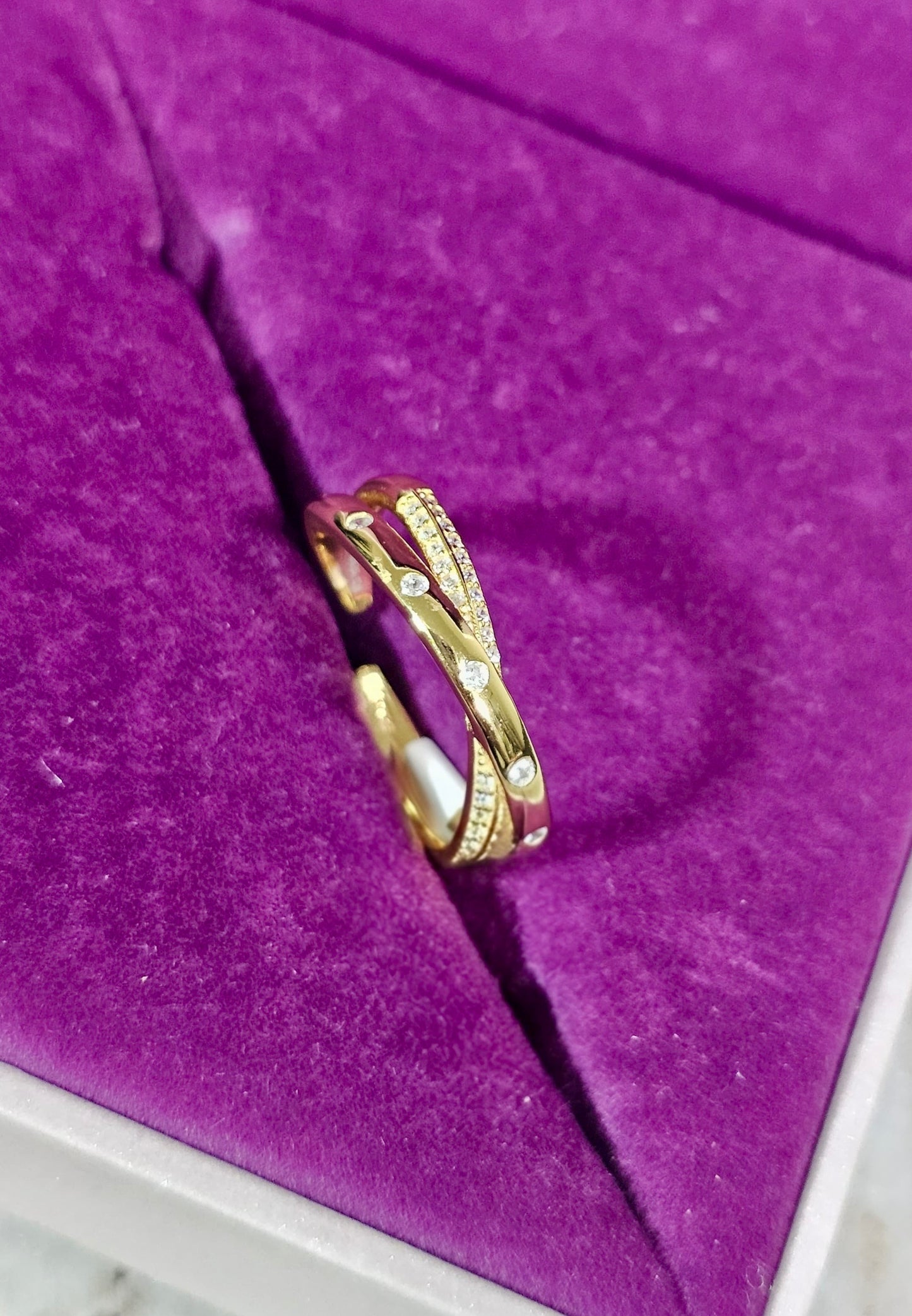 Golden Glint Crisscross Ring – CZ Luxe in a Modern Twist