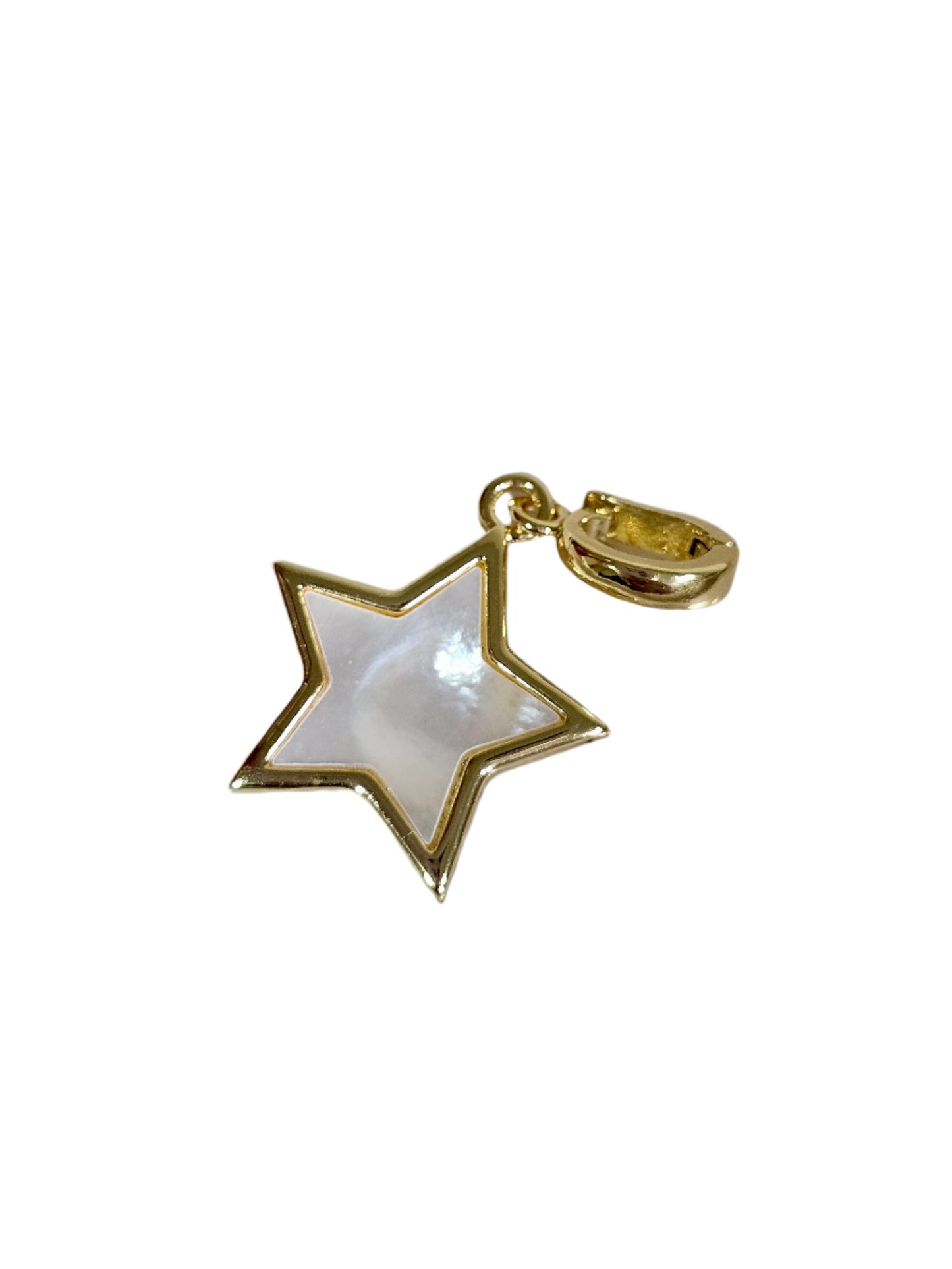 Gold star-shaped pendant on a marble surface