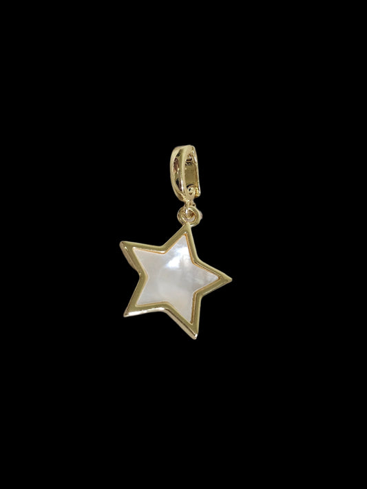 Gold star-shaped pendant on a marble surface